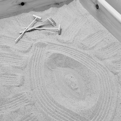 A photograph of a cat looking relaxed on a chair in my therapy room